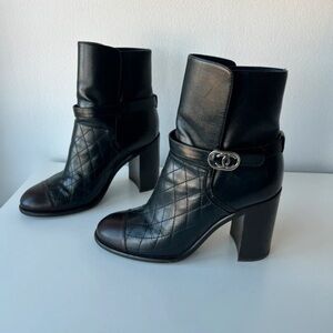 CHANEL Black Quilted Leather Ankle Boots with Silver Logo Accent